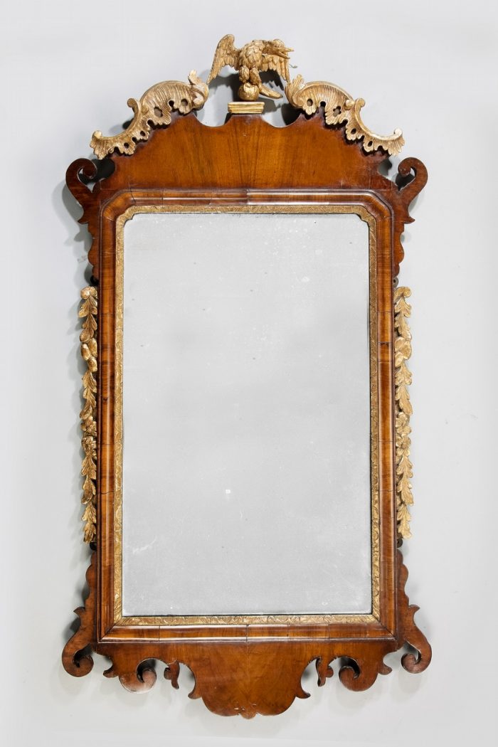 A George II walnut and parcel gilt mirror