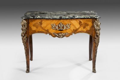 A rare 19th Century French Serpentine Table with a marble top and ormolu mounts.