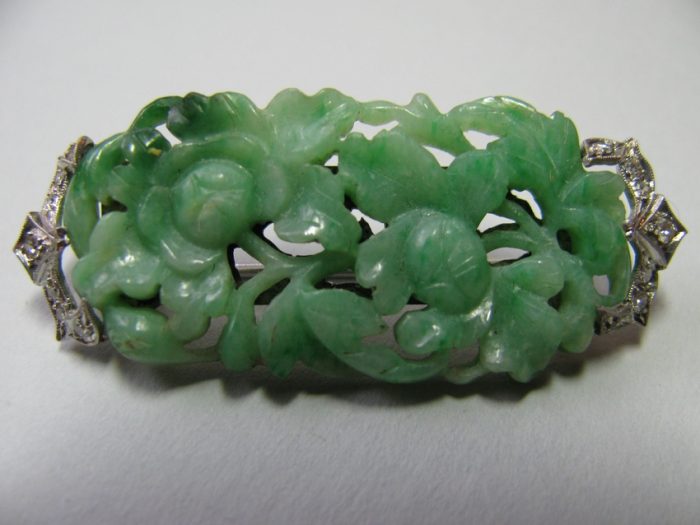 Carved jade and diamond pin